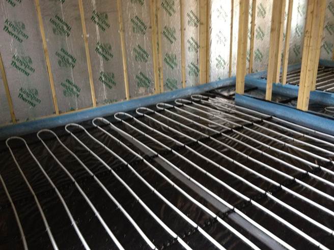 Recently installed underfloor heating pipes seen in home conversion in progress