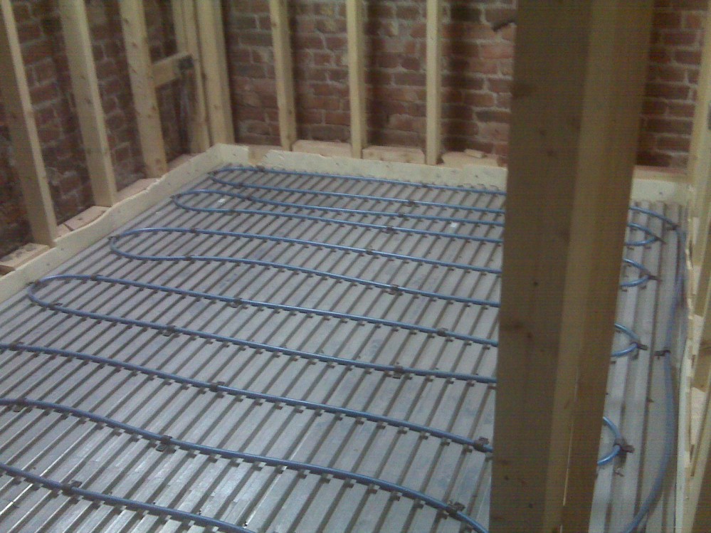 Underfloor heating pipes installed awaiting screed floor laying