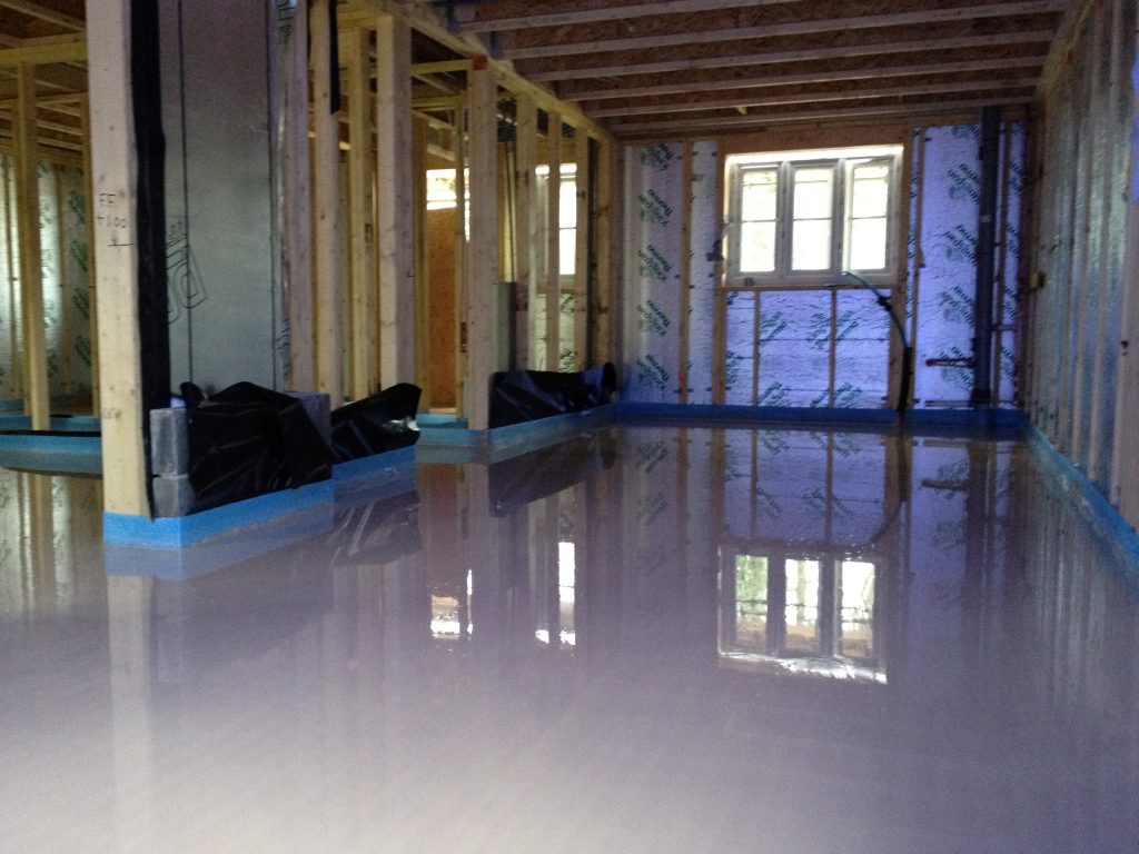 Wet liquid flow screed floor seen in home conversion in progress