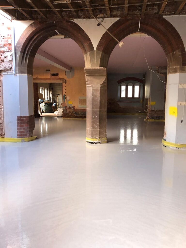 liquid flow floor screed seen in an unfinished building conversion project